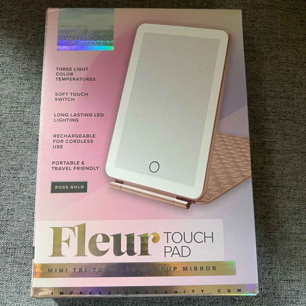 Impressions vanity touch pad mirror